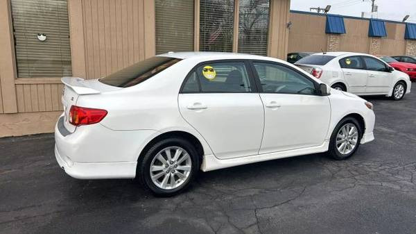 Angle shot of the 2010 Toyota Corolla LE highlighting its front fender and wheel