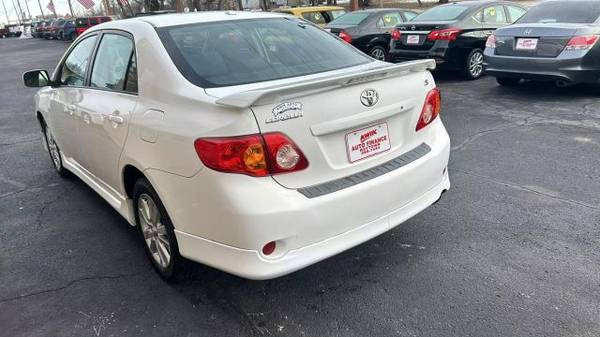 Close-up of the alloy wheels on a 2010 Toyota Corolla LE sedan