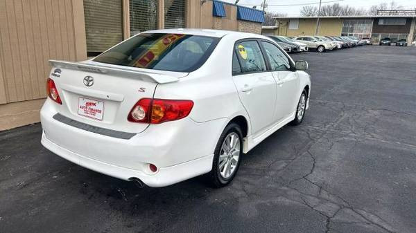 Image showcasing the spacious interior of the 2010 Toyota Corolla LE from the rear seats