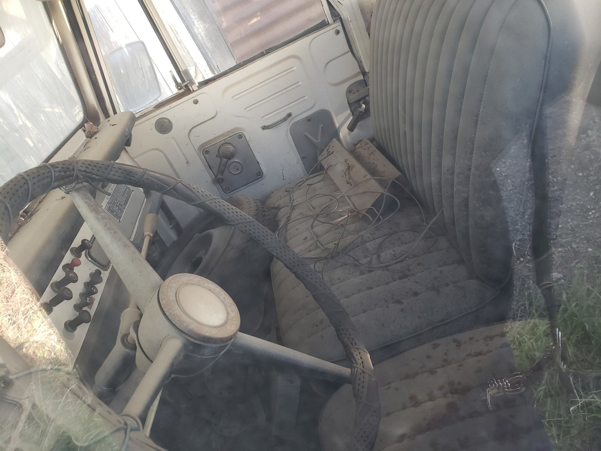 Interior view of a 1969 Toyota Land Cruiser J40 showcasing the dashboard and steering wheel