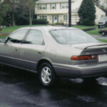 Front exterior view of a 1997 Toyota Camry LE sedan in silver, showcasing its classic design.