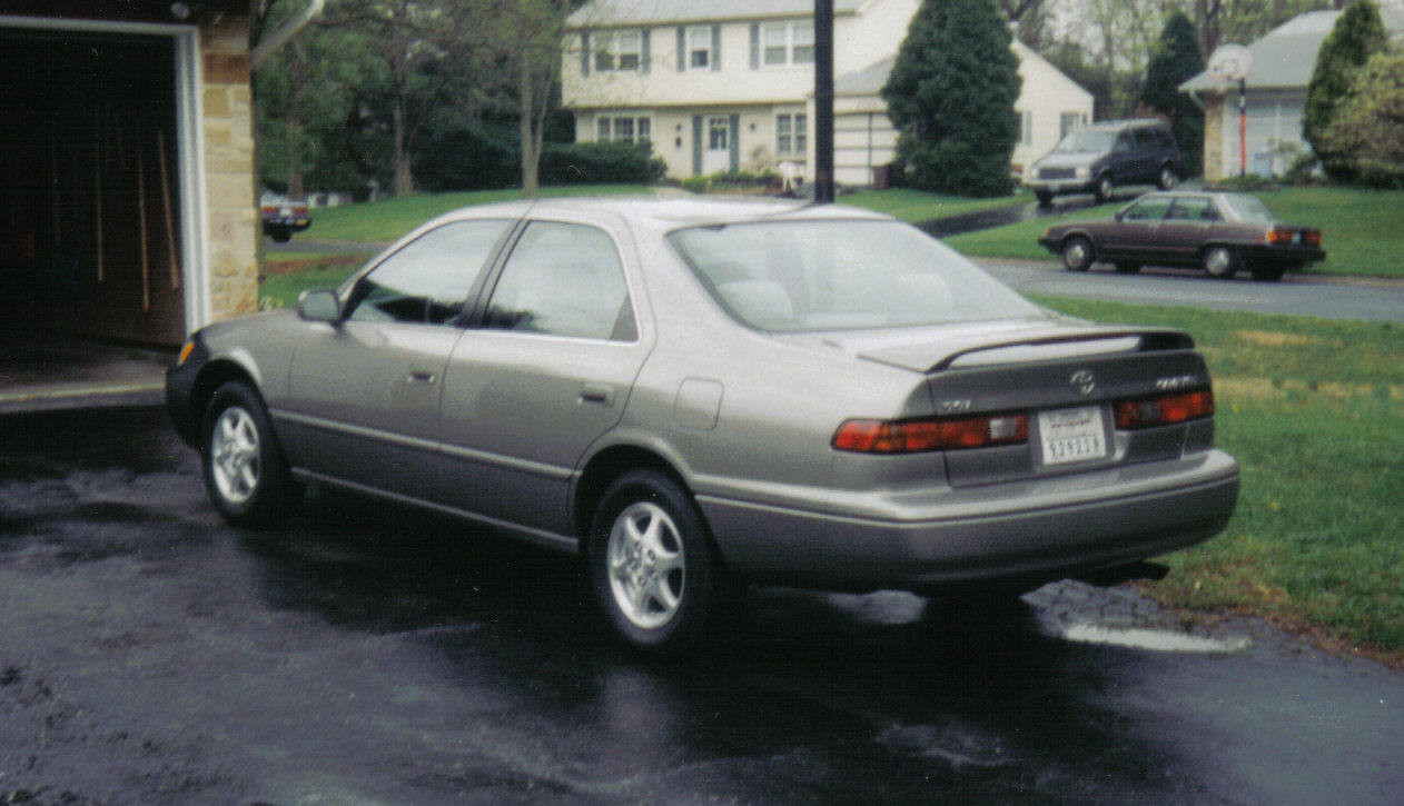 Front exterior view of a 1997 Toyota Camry LE sedan in silver, showcasing its classic design.