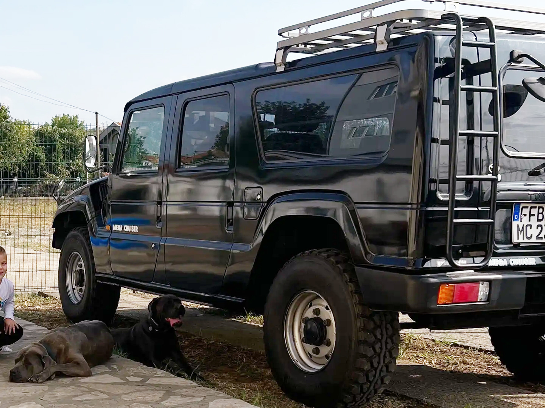 Exterior view of the black Toyota Mega Cruiser