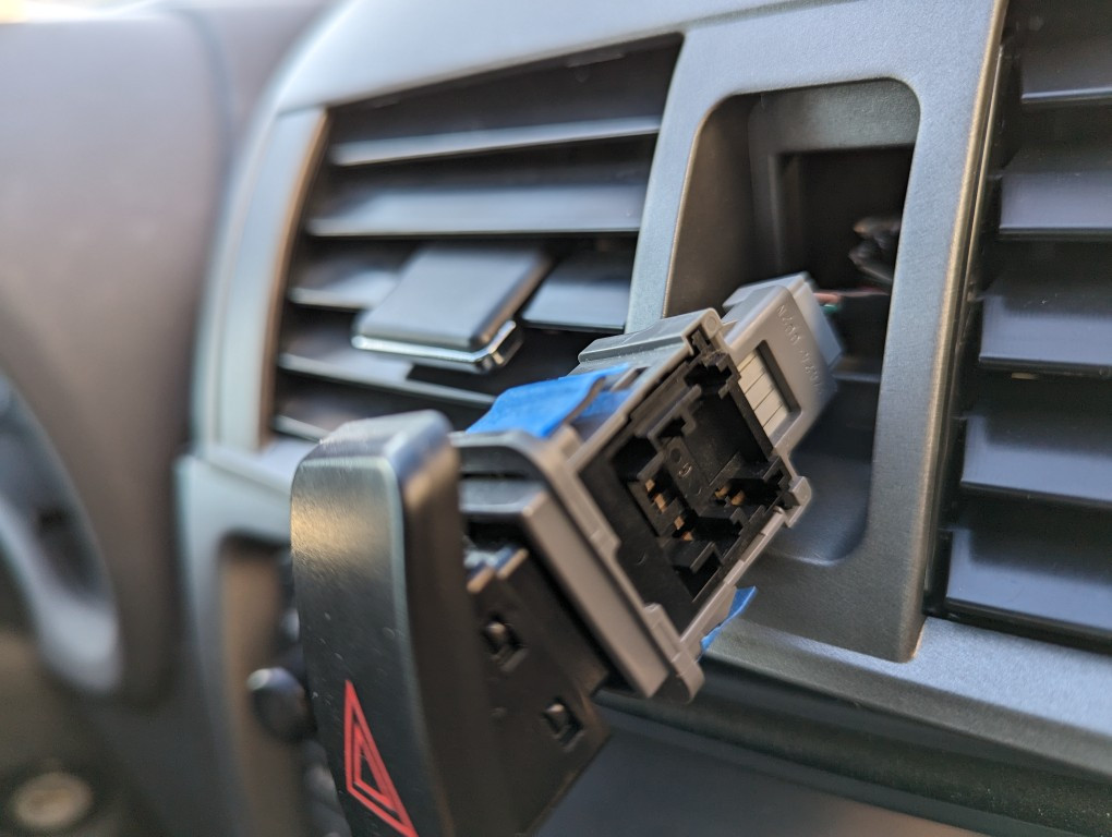 Multiple angles showing masking tape fix for loose caution switch in the new 2013 Toyota Corolla air vent.