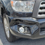 Front end damage to a Toyota Sequoia after an unexpected deer collision, necessitating auto body repairs.