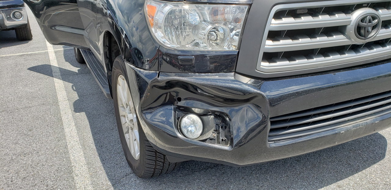 Front end damage to a Toyota Sequoia after an unexpected deer collision, necessitating auto body repairs.