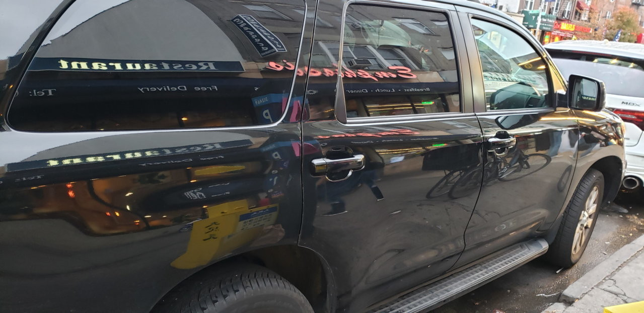 Toyota Sequoia door handle with temporary vinyl wrap, experimenting with cosmetic car modifications.