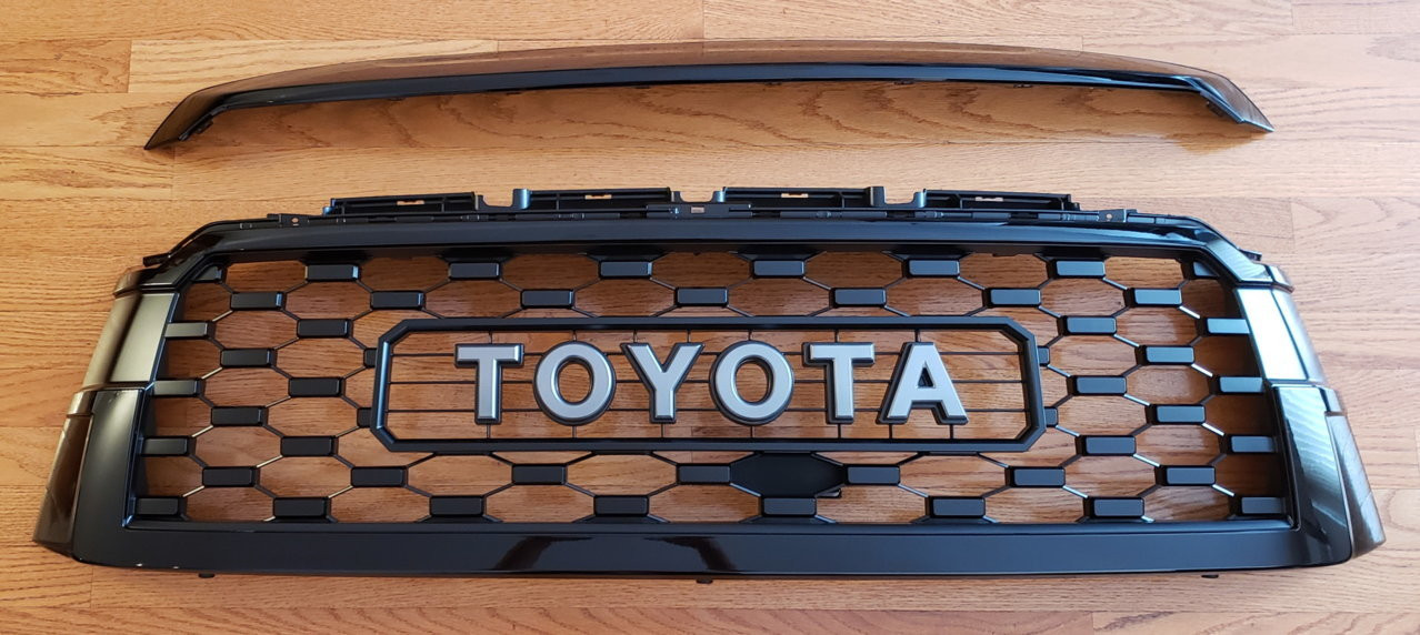 Front grille of a Toyota Sequoia upgraded to a 2020 TRD Pro grille in attitude black, showcasing a significant style enhancement.