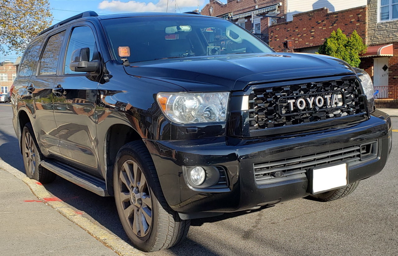 Full front view of a Toyota Sequoia with the new 2020 TRD Pro attitude black grille installed, dramatically altering the vehicle's appearance.