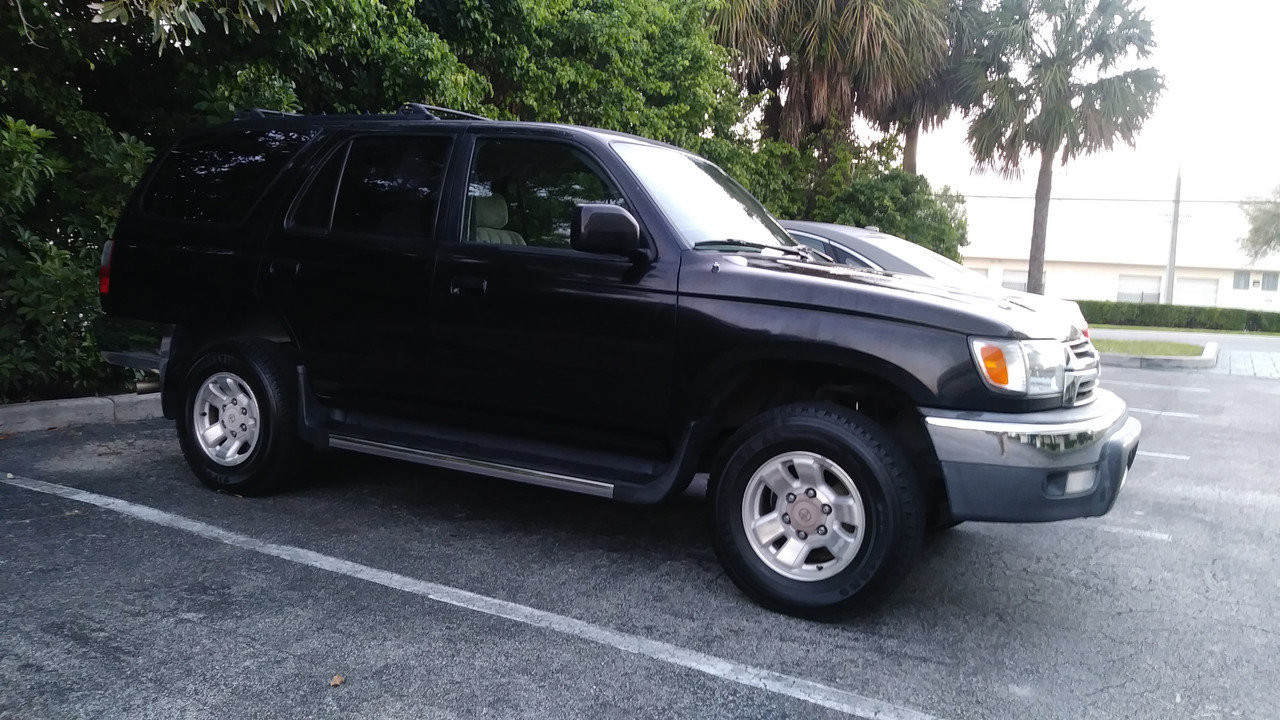 Inspecting the ABS sensor on a 2002 Toyota 4Runner.