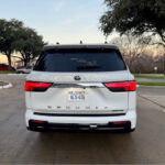 Rear view of the 2025 Toyota Sequoia 1794 Edition, highlighting the taillights, spoiler, and 20-inch alloy wheels.