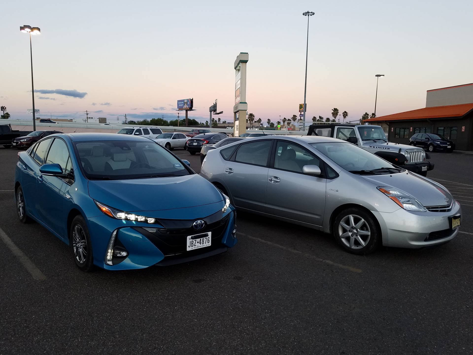 Interior of the 2017 Toyota Prius Prime featuring the 11.6-inch touchscreen and white seats