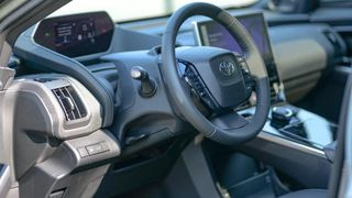 Cockpit-style driver's seat in the Toyota bZ4X electric vehicle.