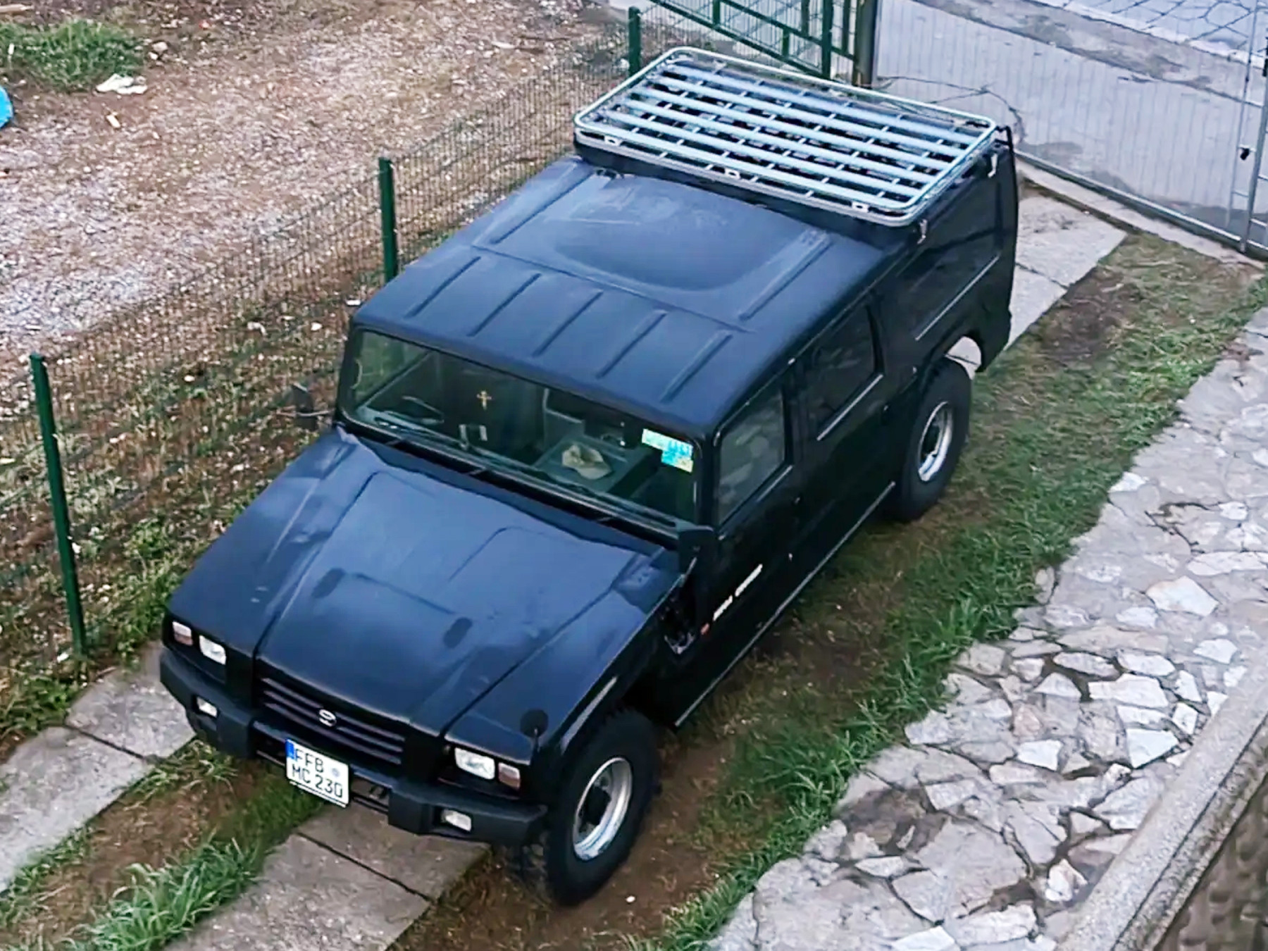 Front view showcasing the Toyota Mega Cruiser's size and four-wheel drive system