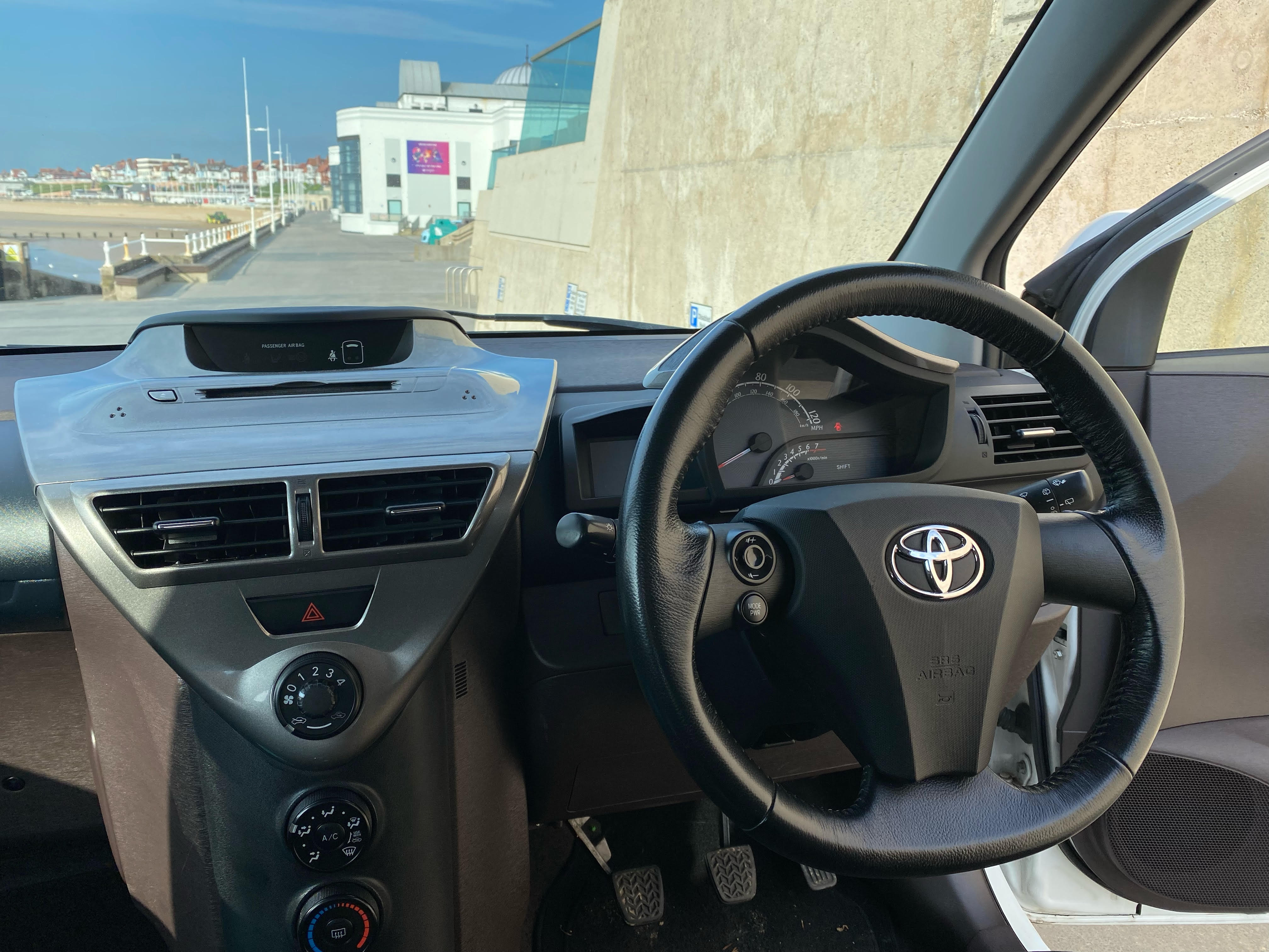 Interior view of the Toyota iQ showcasing its surprisingly spacious design.