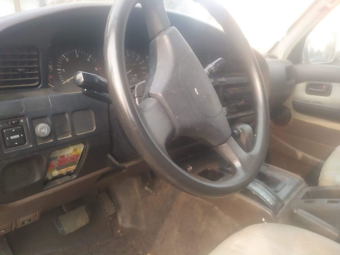 Interior view of the 1992 Toyota Land Cruiser, showcasing the dashboard and front seats.