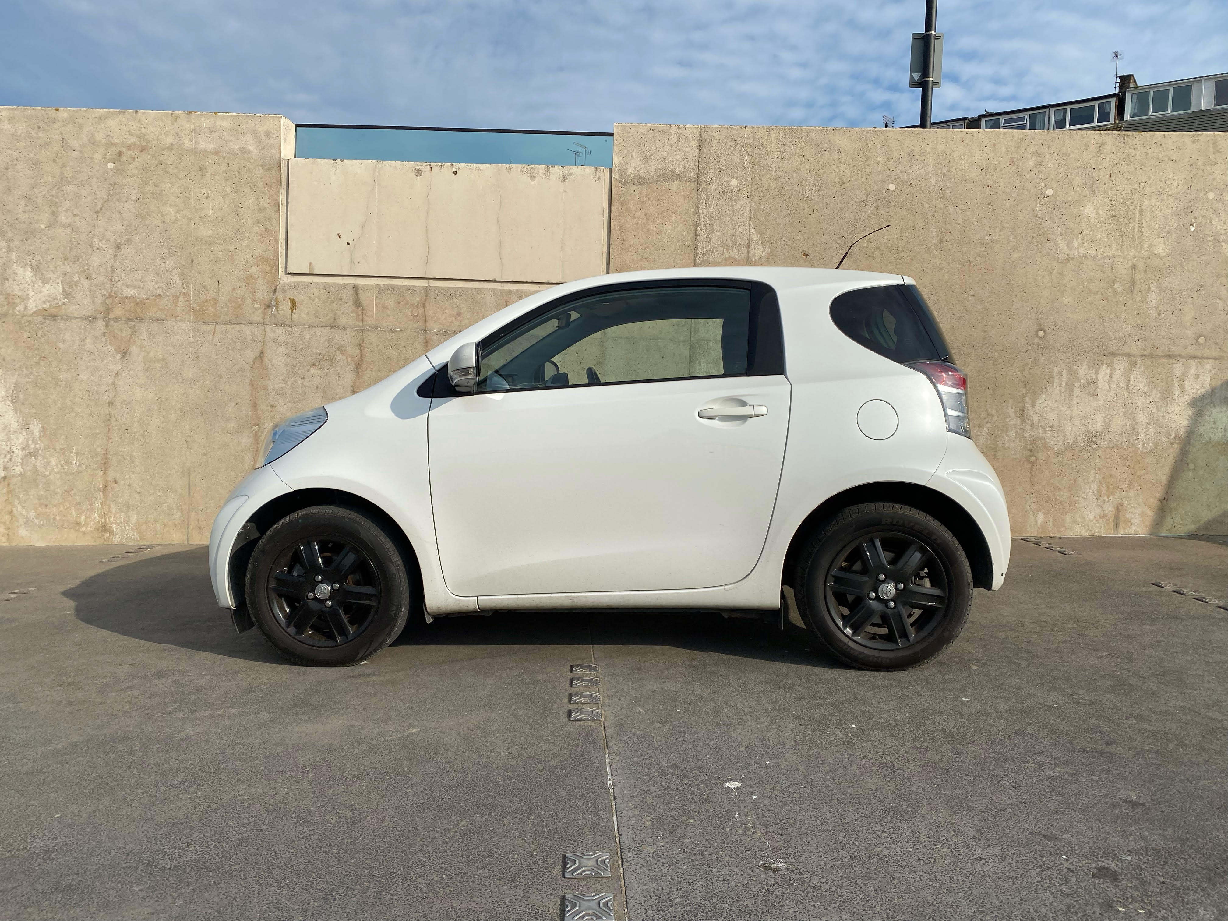 A modified Toyota iQ with a sporty body kit.