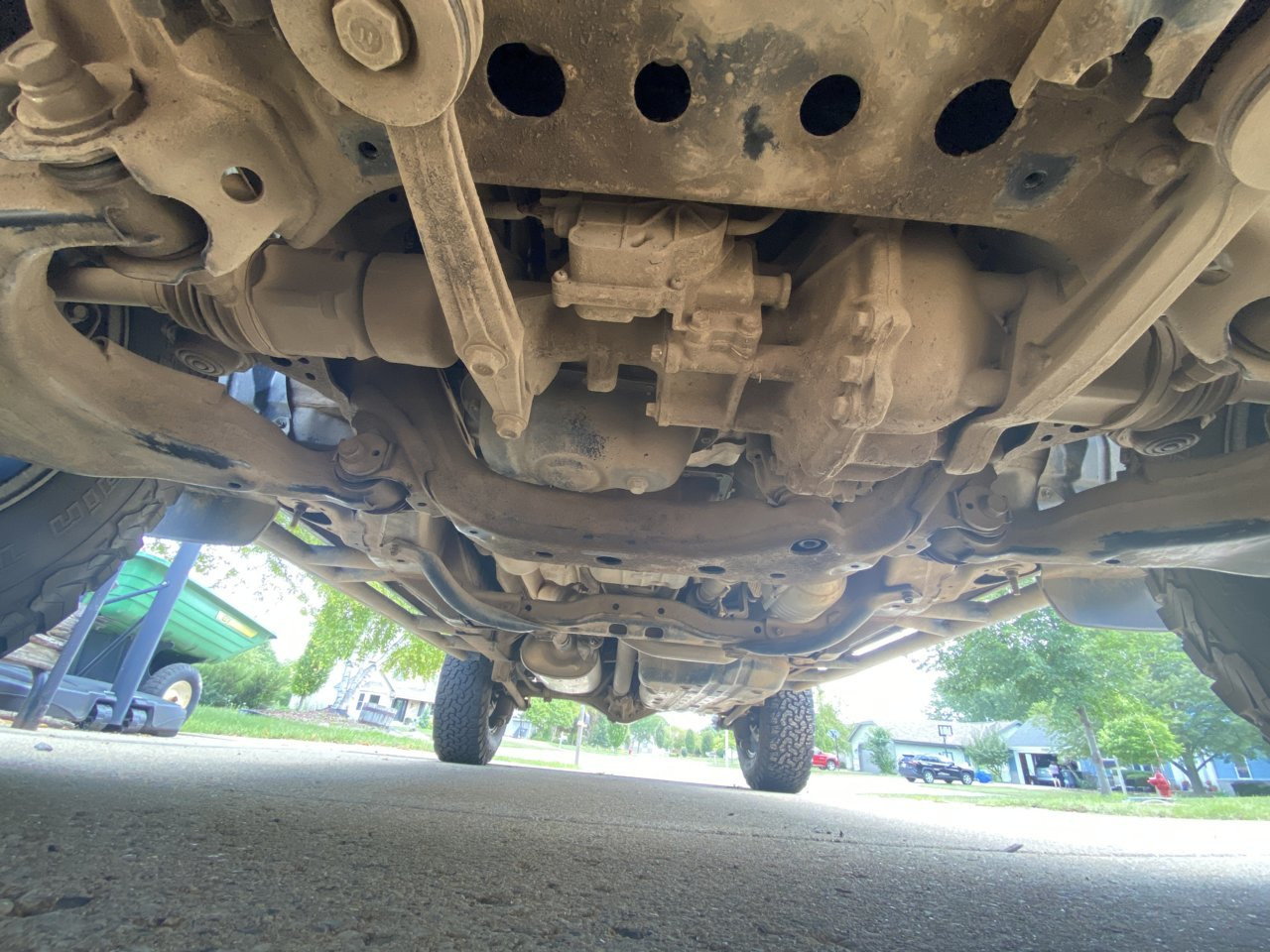 Close-up of Toyota 4Runner undercarriage showing black painted protective coating