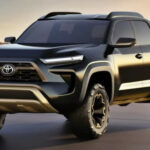 alt text: Matte black Toyota Stout 2025 compact pickup truck, front three-quarter view, parked on a paved surface, showcasing its modern design and truck bed.