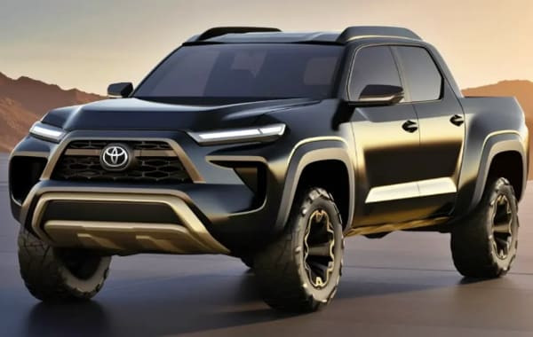 alt text: Matte black Toyota Stout 2025 compact pickup truck, front three-quarter view, parked on a paved surface, showcasing its modern design and truck bed.