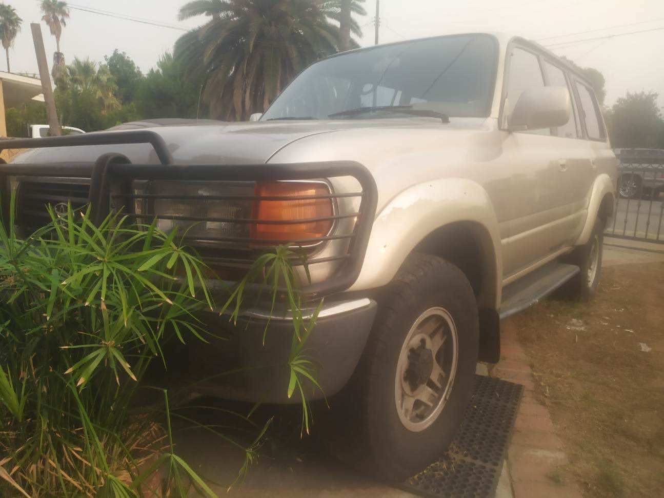 Close-up of the front grille and headlights of the 1992 Toyota Land Cruiser FJ80.