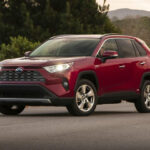 Exterior view of a White Toyota RAV4 showcasing its modern SUV design and clean lines