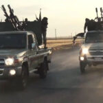 ISIS militants race through Raqqa in a propaganda training film released online in September 2014. Toyota Hilux pickups and Land Cruisers are visibly prominent in the fleet of vehicles used.