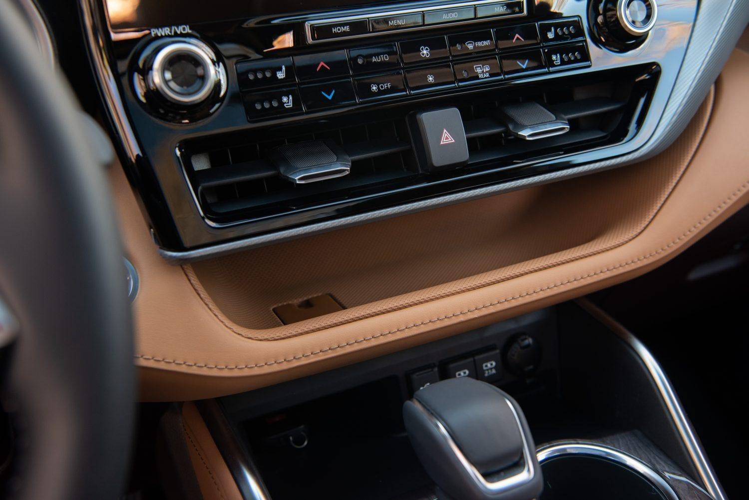 Close up of the center console in the 2020 Toyota Highlander showcasing storage compartments