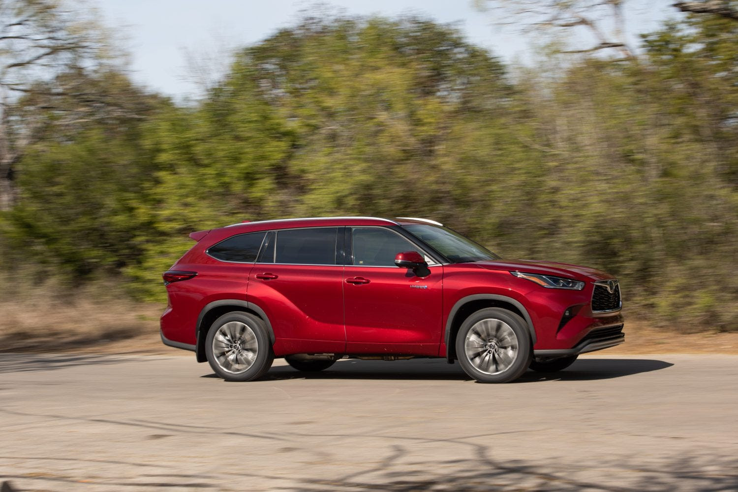 Passenger side view of the 2020 Toyota Highlander interior, highlighting the dashboard and storage areas