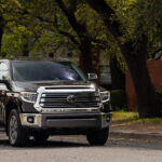 2020 Toyota Tundra 1794 Edition front view showcasing chrome grille and Voodoo Blue color