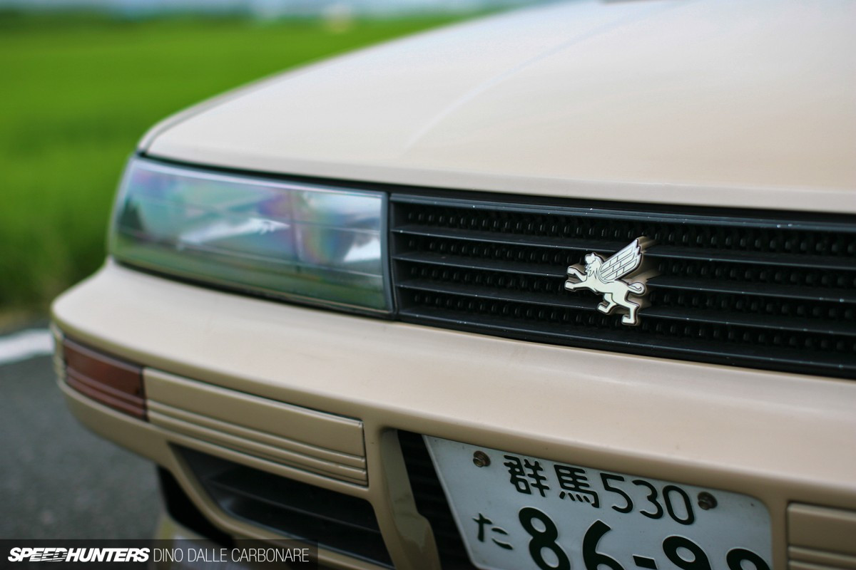 Rear three-quarter view of the Toyota Soarer Z20 highlighting the widened rear fenders and TE37SL wheels