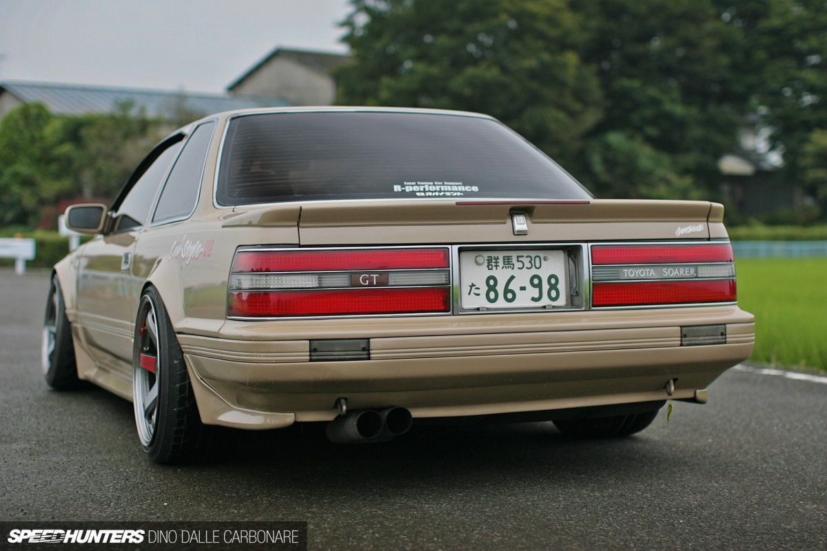 Front three-quarter view of the Toyota Soarer Z20 highlighting the S130 Z hood vents and custom headlights