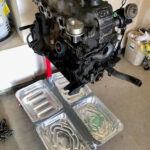 Refurbished cylinder head for 1982 Toyota Pickup sourced from Yota1 in Modesto, ready for installation.