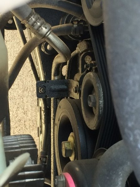 Wider angle showing the location of the oil leak on the Toyota Tacoma, prompting search for a local Toyota mechanic in Jurupa Valley.