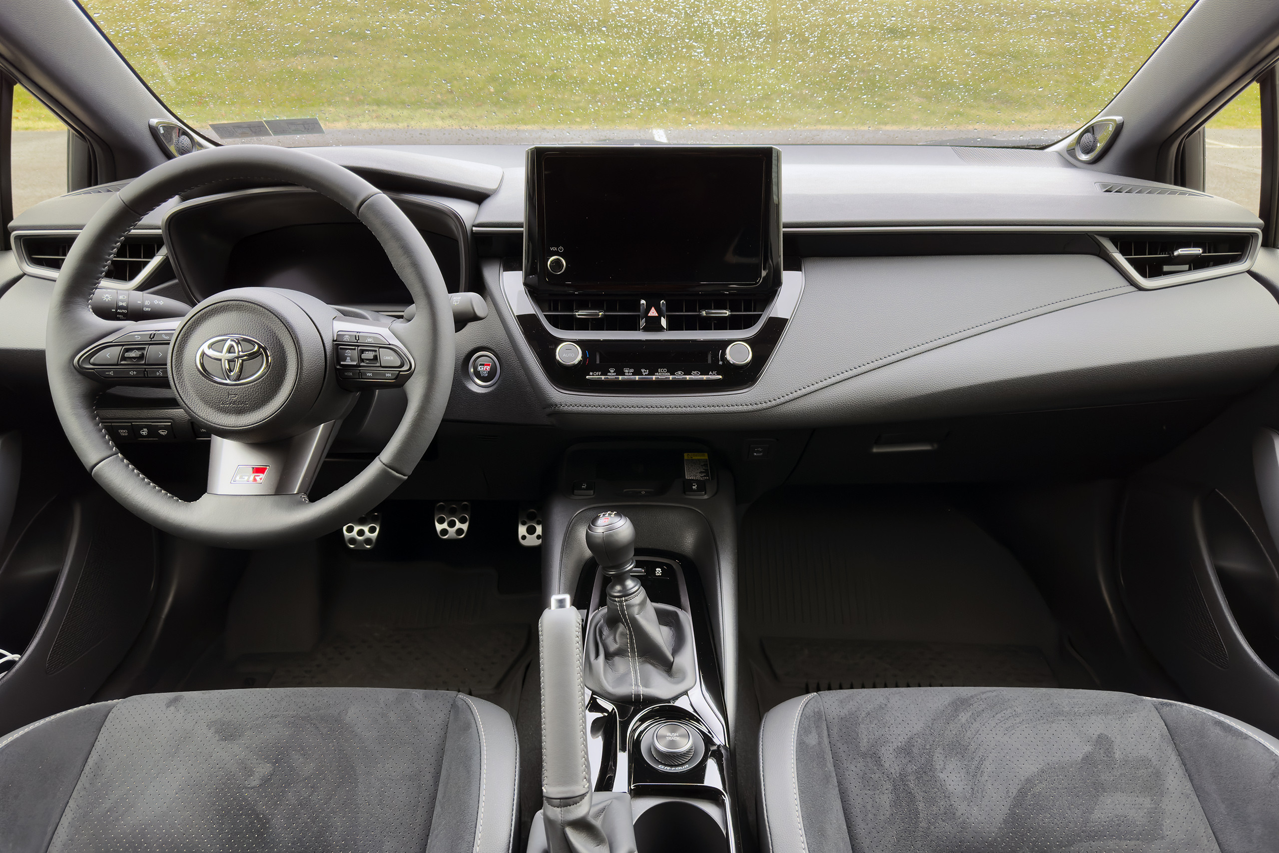 alt text: Infotainment screen and center console of a Toyota Corolla