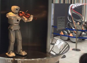 A Toyota robot showcases its versatility by playing &quot;Pomp and Circumstance&quot;, highlighting the advanced technology within Toyota Japan's facilities.