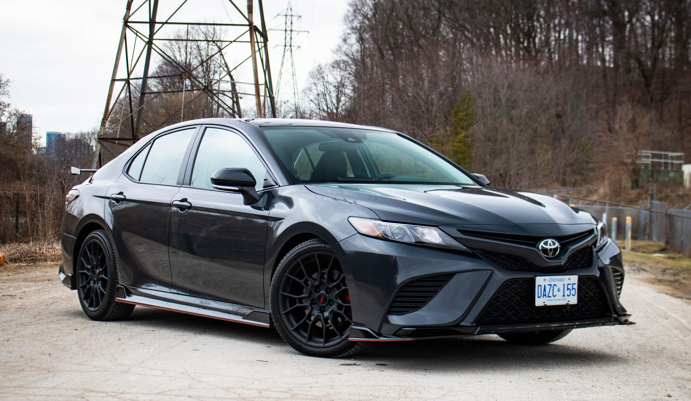 Rear view of the 2024 Toyota Camry TRD V6, highlighting the TRD exhaust and rear diffuser elements.