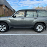 Exterior view of the 1998 Toyota Land Cruiser showing its front and side.