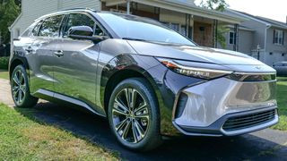 Sleek and futuristic design of the 2024 Toyota bZ4X Limited electric car during a test drive.