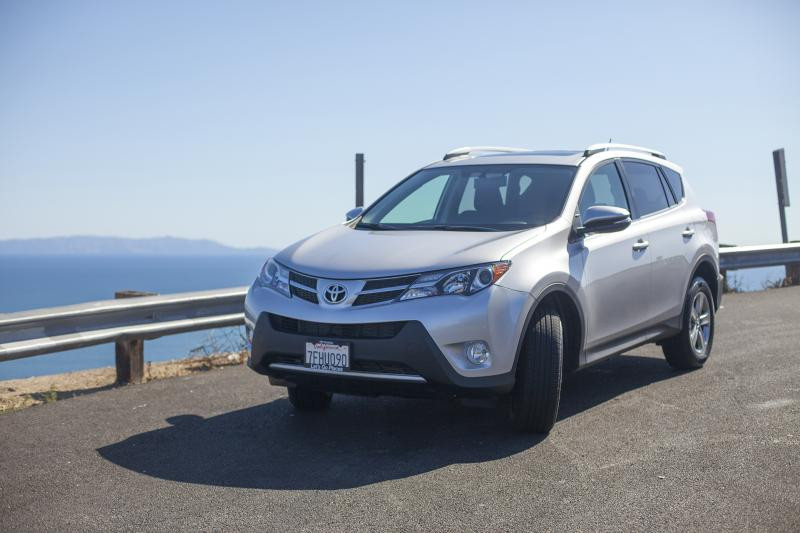 Exterior view of a silver 2015 Toyota RAV4. The alt text is: 2015 Toyota RAV4 XLE exterior styling.