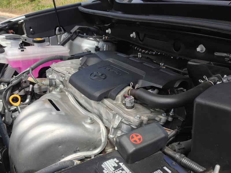 Engine bay of the 2015 Toyota RAV4 highlighting the 2.5L 4-cylinder engine.  The alt text is: 2015 Toyota RAV4 XLE 2.5L engine.