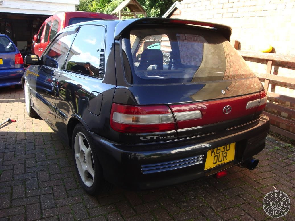 Close-up of the Enkei wheels and Meister-r coilovers, performance parts already installed on the Toyota Starlet GT EP82.