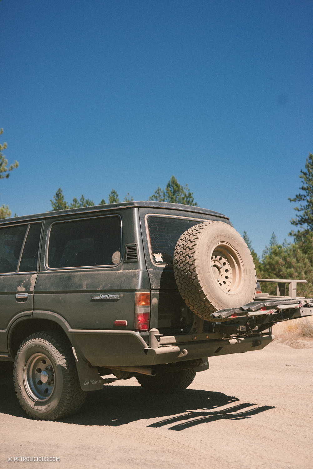 Toyota Land Cruiser climbing a rocky trail in the mountains