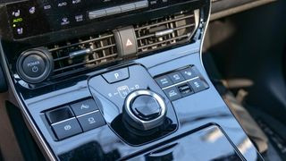 Closeup of the conveniently placed shifter in the 2024 Toyota bZ4X Limited electric car's interior.