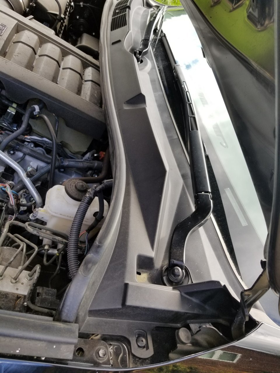 Driver side after cowling removal for A/C intake access