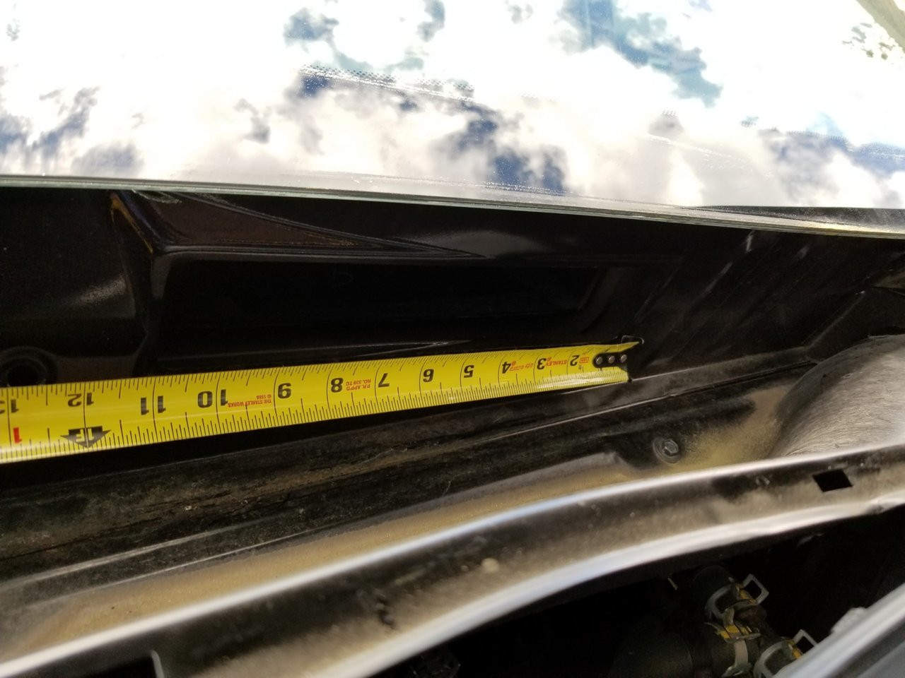 Cutting the gutter guard for A/C intake