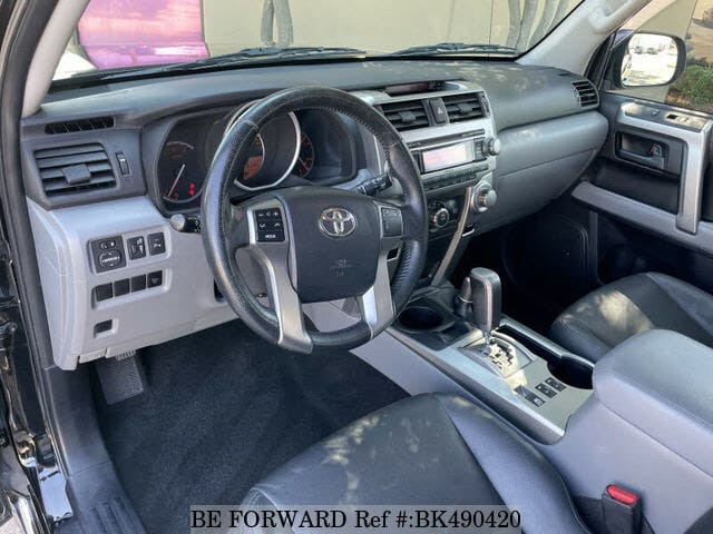 Black front panel of toyota 4runner showcasing its customization options with aftermarket wheels and grille replacements