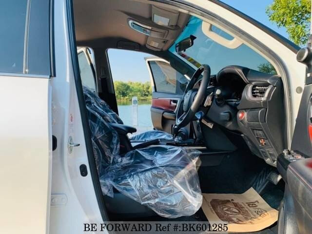 White interior of toyota fortuner showcasing its spaciousness and seating capacity, ideal for families