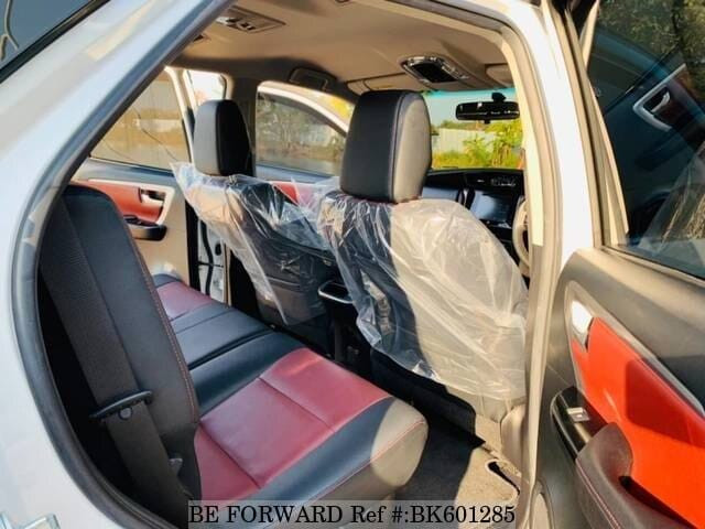 White interior of toyota fortuner emphasizing its luxurious design with leather upholstery and advanced infotainment systems