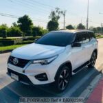 White front of toyota fortuner showcasing its sleek design and chrome accents, highlighting its urban appeal